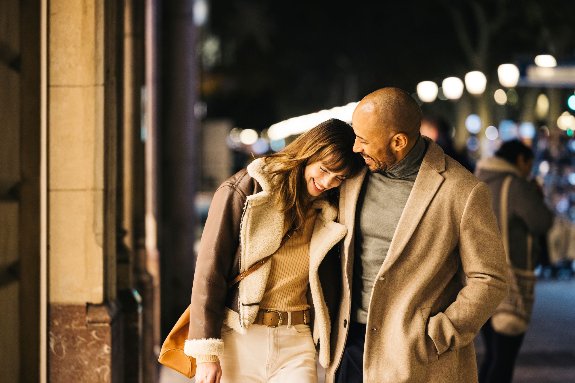 Male nd female couple walking on street for date night